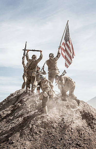 istock Soldiers Raising the US Flag 490781848