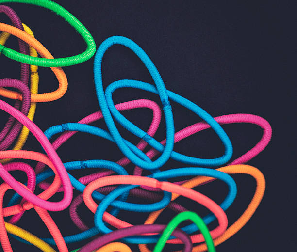 istock Vibrant hair elastic ties on black background 490784936