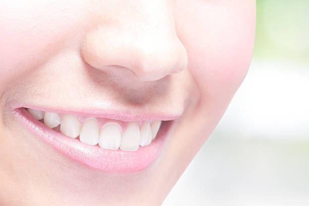 istock young woman health teeth 490786152