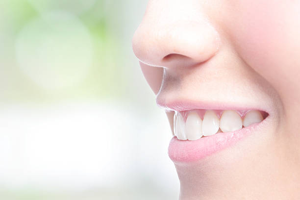 istock young woman health teeth 490786192