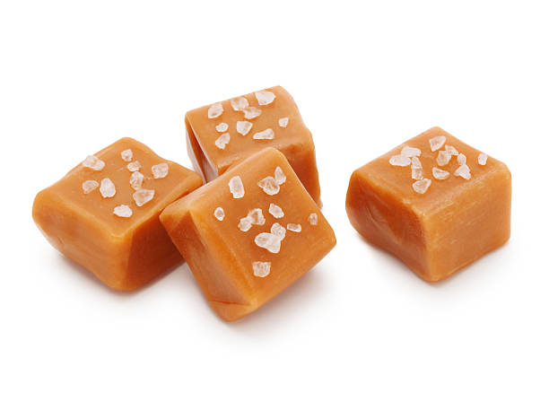Salted Caramel Candies Salted Caramel Candies isolated on white chewy photos stock pictures, royalty-free photos & images
