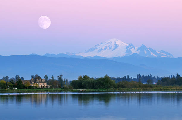 Moonrise over Mt. Baker at Wiser Lake Moonrise over Mt. Baker at Wiser Lake, Washington mt baker stock pictures, royalty-free photos & images