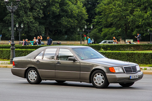 Berlin, Germany - August 15, 2014: Motor car Mercedes-Benz W140 S-class drives at the city street.