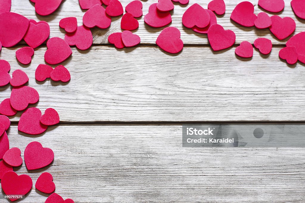 Heart background Copyspace old wooden background with messed red hearts. Above Stock Photo