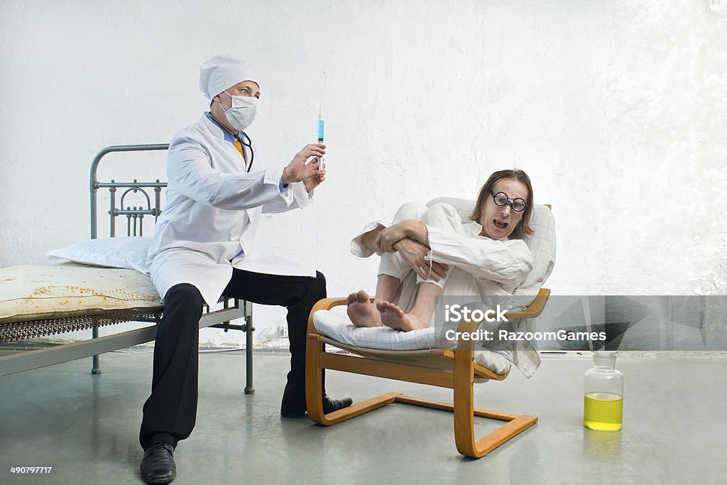 Doctor and patient The patient is afraid of injections Adult Stock Photo