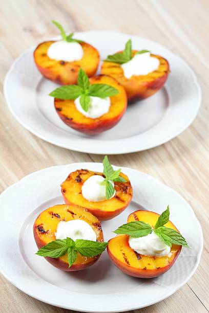 istock Grilled peaches and mascarpone with mint  leaves 490799296