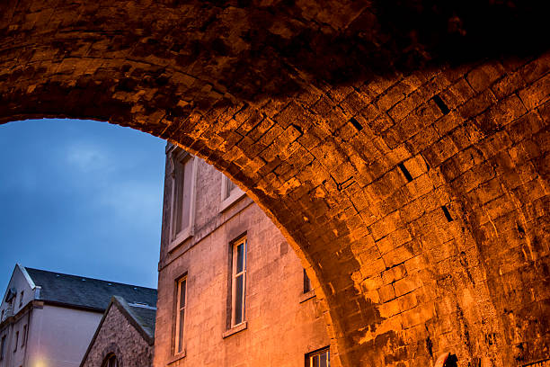 istock Shadowy, stone Edinburgh bridge illuminated in dramatic light at dusk 490799579