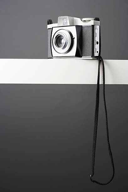 istock Vintage photo camera on shelf, studio shot 490800011