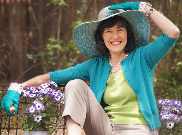 istock Resting On a Garden Bench, Happy Senior Woman 490800239