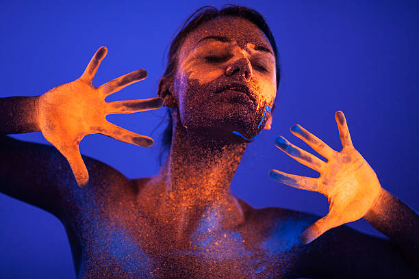 Portrait painted with fluorescent makeup under the ultraviolet l