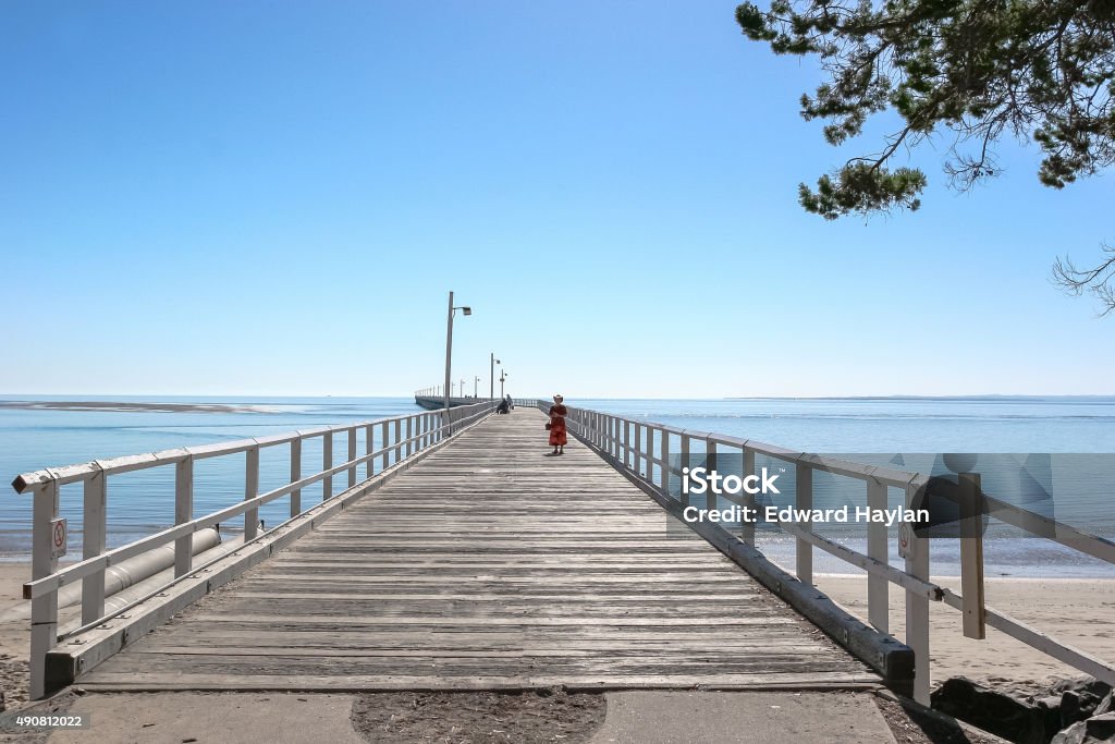 Lady On The Pier Lady on the pier at Hervey Bay, Queensland Australia. Hervey Bay Stock Photo