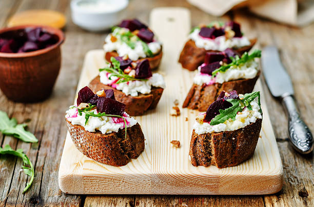 istock beet goat cheese arugula walnut honey crostini 490813116