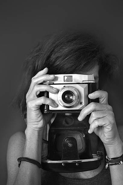 istock Woman Photographer With Old Camera Black And White 490814430