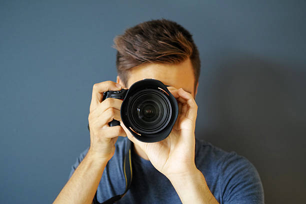 Photographer With Grey Background stock photo