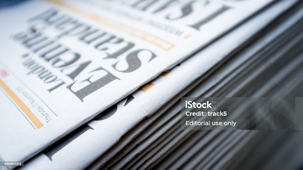 London Evening Standard newspaper London, UK - 17 November 2011: A pile of London Evening Standard newspapers.  The publication is free and found at most London Underground stations during rush hour. Evening Standard Stock Photo