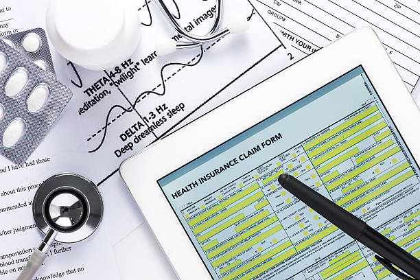 istock Online insurance claim form with stethoscope 490817870