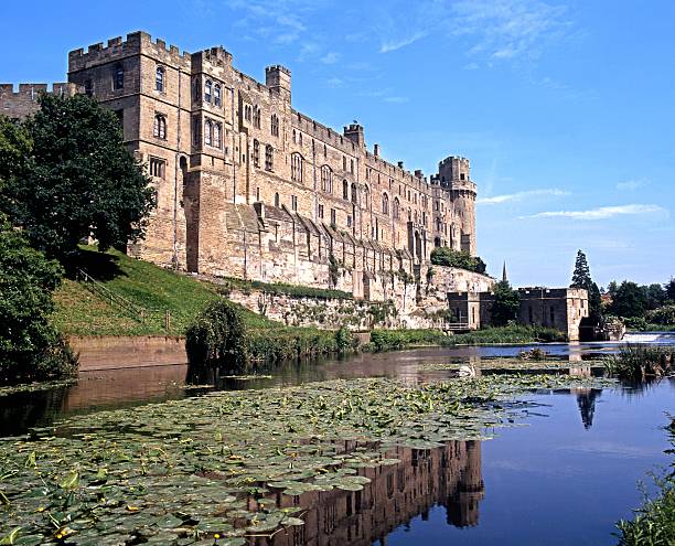 Warwick Castle. Warwick, United Kingdom - June 10, 1992: View of the Medieval castle alongside the River Avon, Warwick, Warwickshire, England, UK, Western Europe. warwick uk stock pictures, royalty-free photos & images