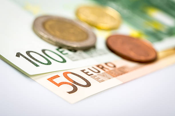 istock Closeup of banknotes and coins 490819266