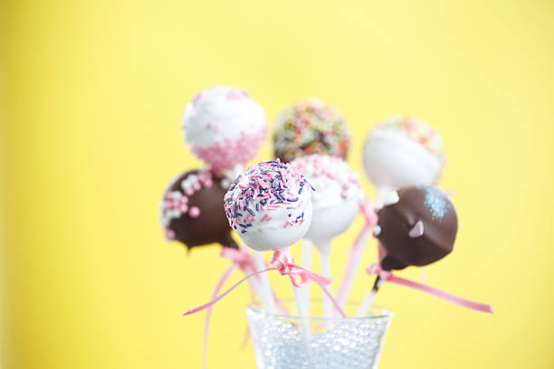 istock Brownie Cakepops Standing up over Yellow 490820209