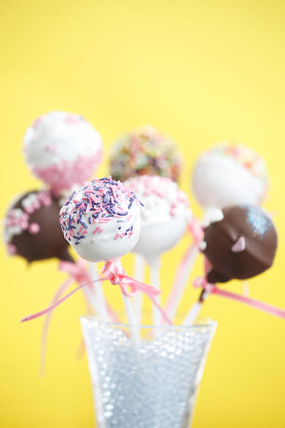 istock Brownie Cakepops Standing up over Yellow 490820217