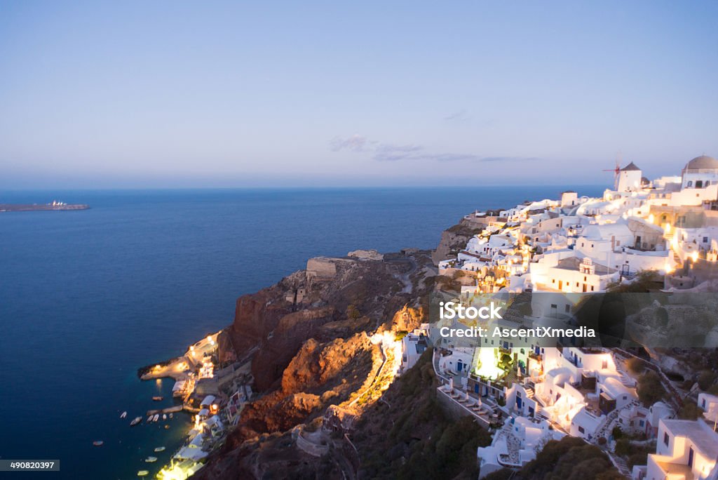 Oia, Santorini at dusk Oia. Santorini in the Cyclade Islands in the Aegean Sea of Greece at dusk Aegean Sea Stock Photo