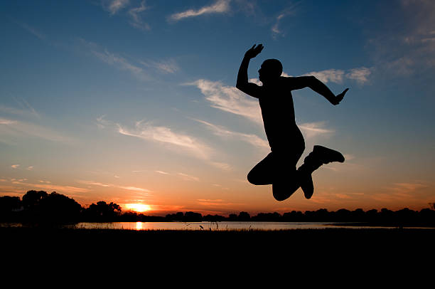 istock silhouette of a man jumping in the sunset 490822823