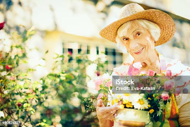 Senior Woman Gardening Stock Photo - Download Image Now - 1980-1989, Flower, Happiness