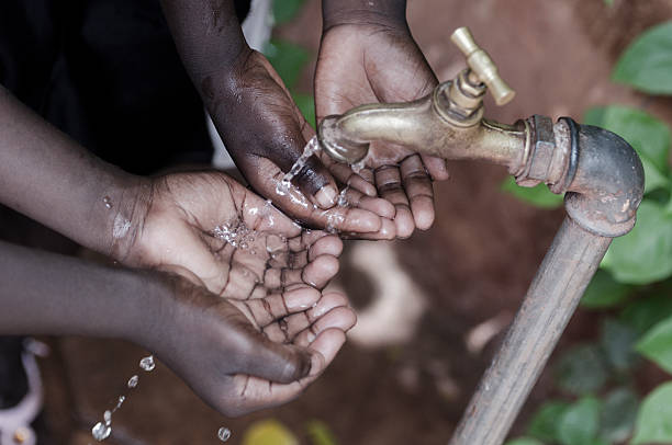 istock Health Symbol: African Children Washing Hands Cupped 490824490
