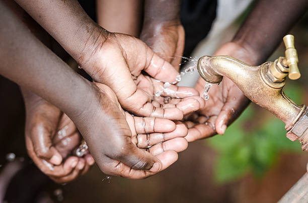istock African Children Asking for Healthy, Fresh, Clean Water 490824600