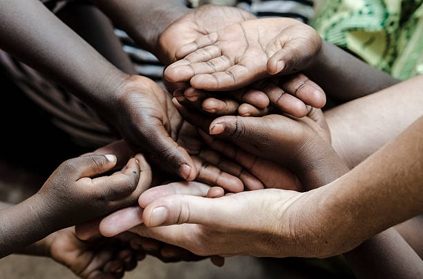 African Hands Cupped (World Social Issues) Health Problems Symbol Water scarcity is still affecting one sixth of Earth's population. African Children in developing countries suffer most from this problem, that causes malnutrition and health problems. begging social issue photos stock pictures, royalty-free photos & images