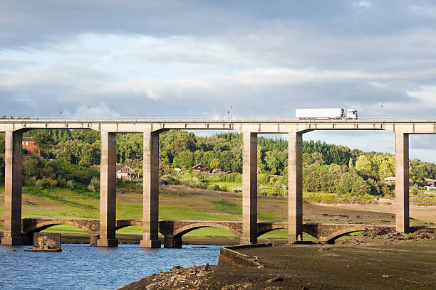 istock Truck, old bridge and viaduct over a reservoir. 490824832