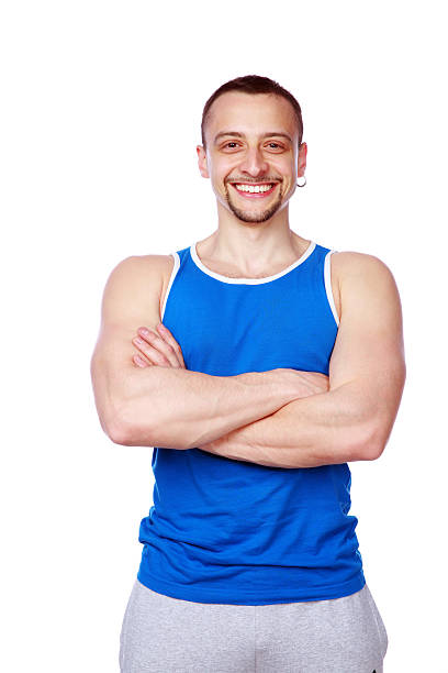istock cheerful sport man with arms folded 490826155