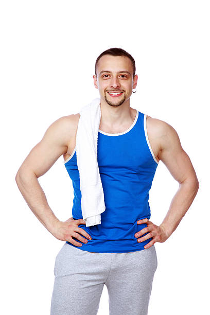 istock Happy sportive man with towel standing 490826165