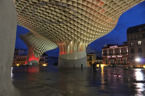 Seville, Spain - November 3, 2012: People visit Metropol Parasol (by architect Jurgen Mayer H) on November 3, 2012 in Seville, Spain. Metropol Parasol (by architect Jurgen Mayer H) claims to be the largest wooden structure in the world.