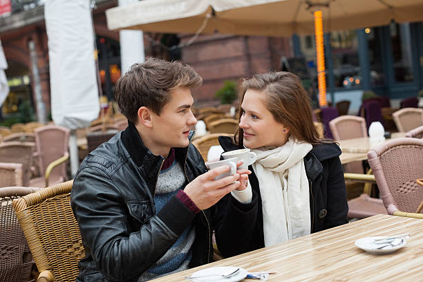 istock Couple Drinking Coffee At Outdoor Restaurant 490826719