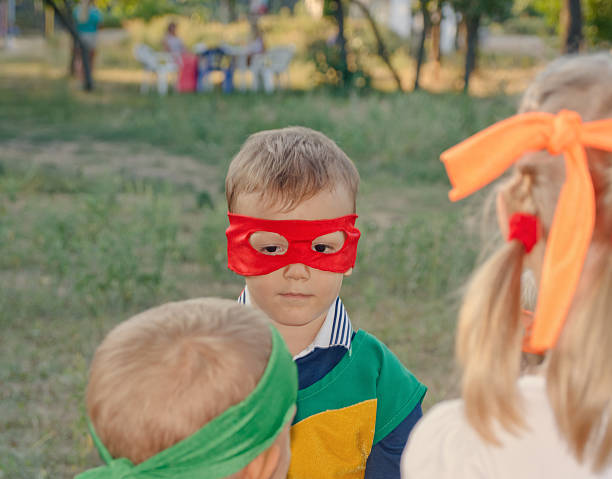 istock Young boy playing at a kids birthday party 490846180