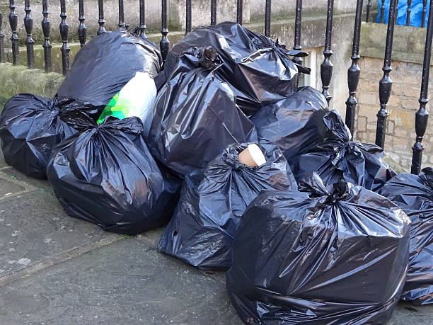 istock Image of black plastic rubbish bags / bin liners on doorstep 490847336
