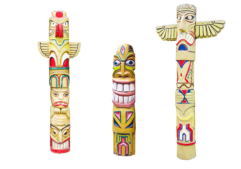 Wooden indian colorful totem pole isolated on white background