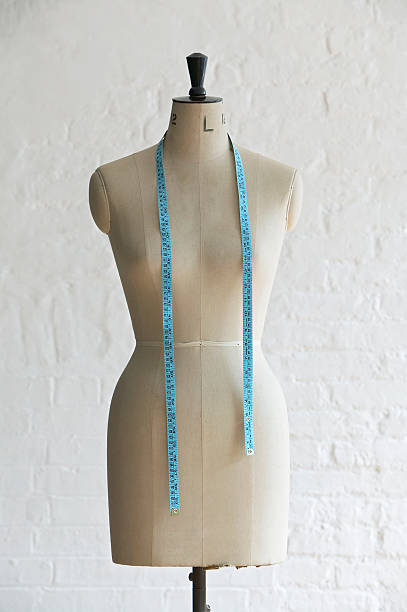 istock Mannequin with hanging measuring tape, indoors 490847439