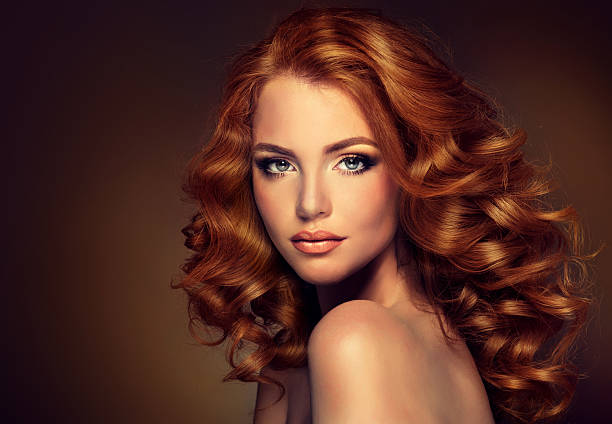 istock Girl model with long curly red hair. 490847536