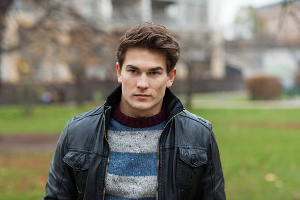 istock Man In Jacket Looking Away At Park 490849067