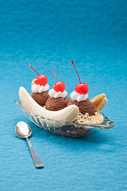 Banana Split Ice Cream Banana Split Ice Cream isolated over color background maraschino cherry stock pictures, royalty-free photos & images