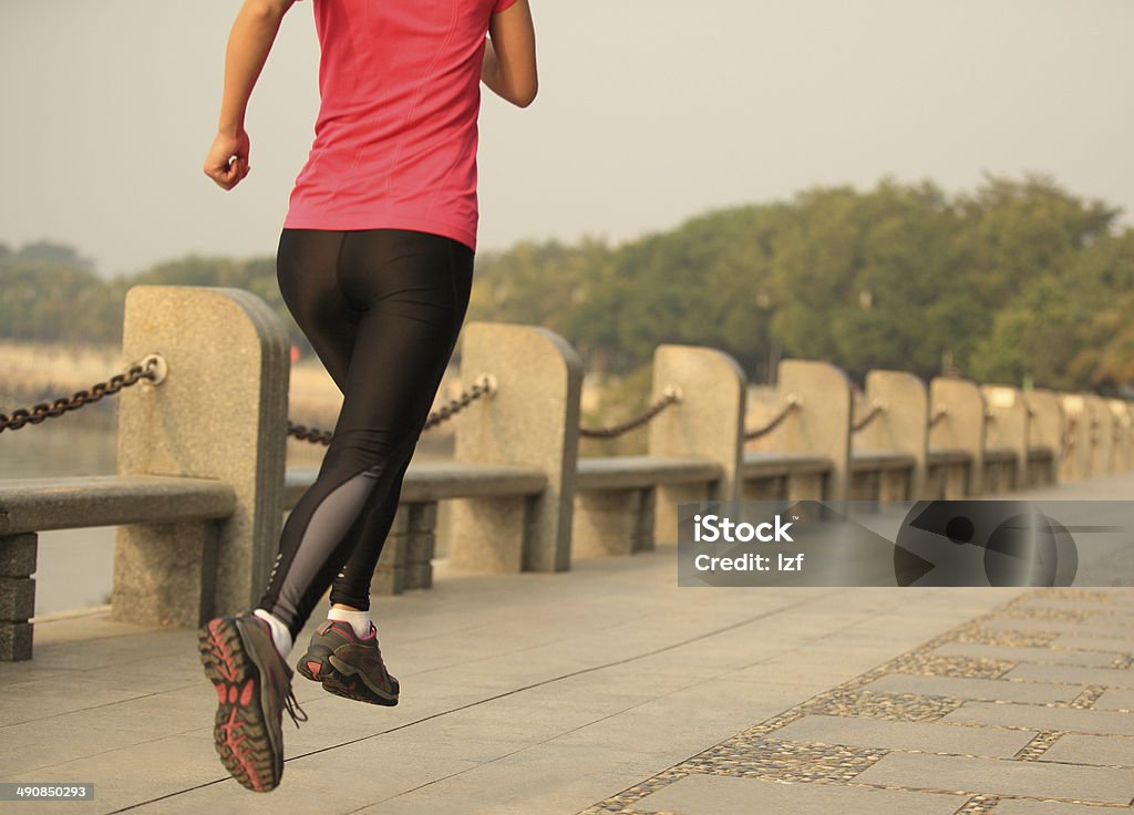 healthy lifestyle sports asian woman running at seaside Active Lifestyle Stock Photo