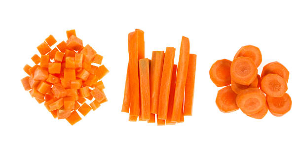 cenouras frescas fatiadas e cubos - carrot isolated white carotene - fotografias e filmes do acervo