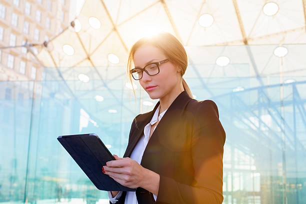 Businesswoman using a digital tablet stock photo