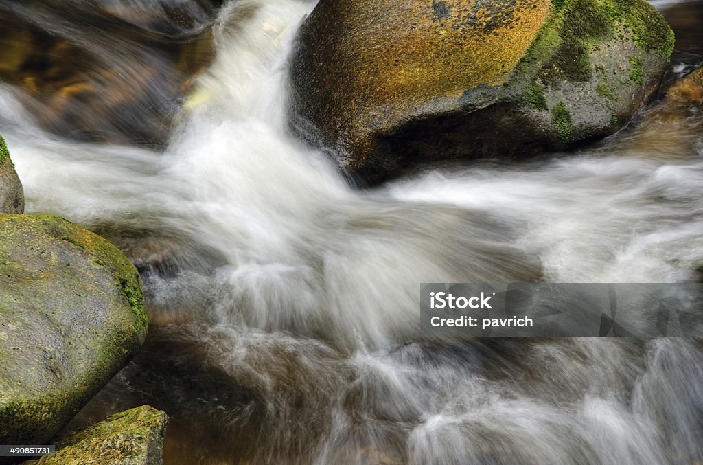 Cascade Detail of small beautiful cascade between mossy stones. Above Stock Photo