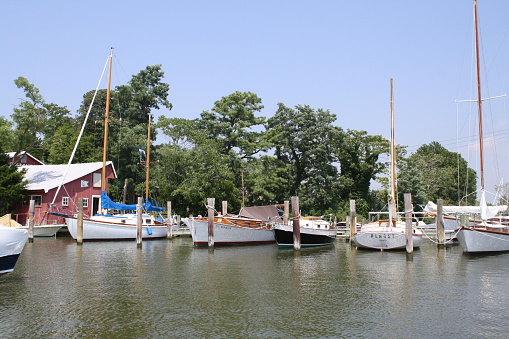 Oxford, Maryland, USA-- July 19, 2013:  Boats docked at Cutts and Case, Inc., a boat yard on Town Creek.