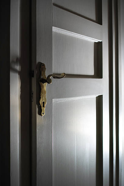 istock White Wood Door With Golden Door Handle Light Effect 490855638