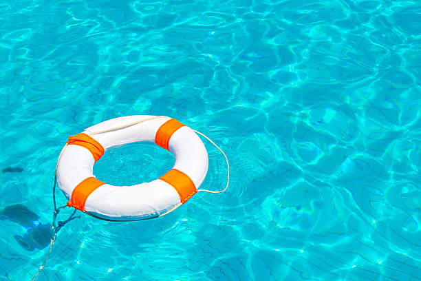 istock Life buoy in swimming pool 490855674
