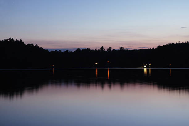 Rural horizon over a lake at sunset stock photo